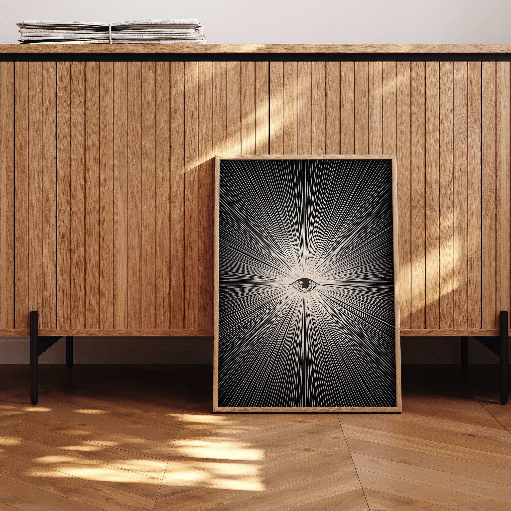 Minimalist ve güçlü bir sanat eseri! Ortasında mistik bir göz bulunan, ışınsal çizgilerle çevrelenmiş siyah-beyaz tasarımlı poster